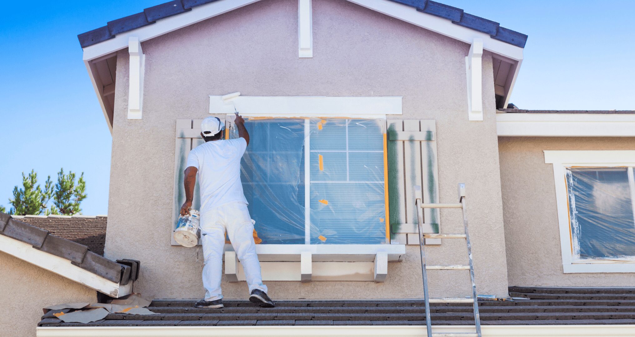 professional painter working on exterior painting